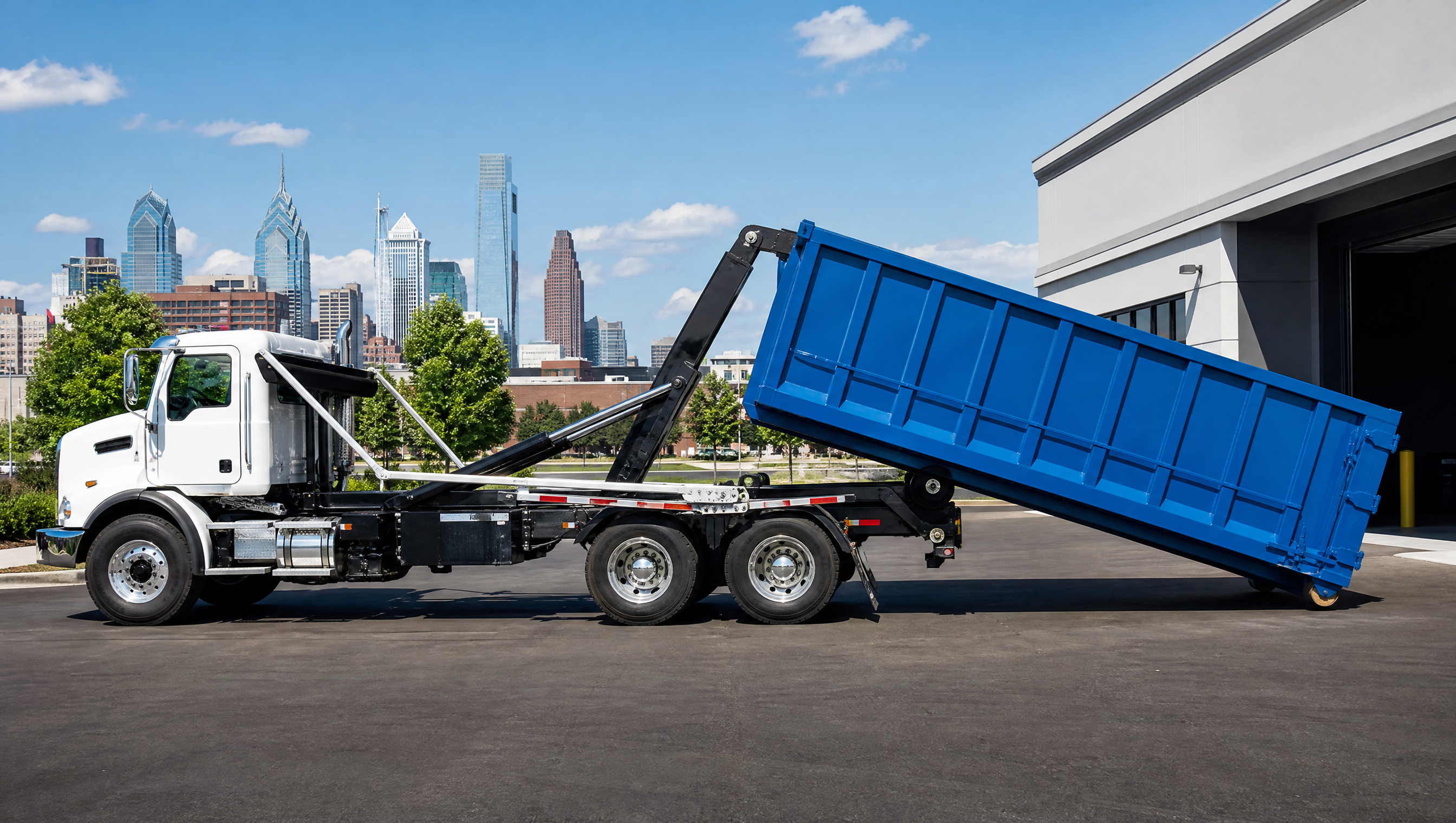 Roll-off truck delivering a container