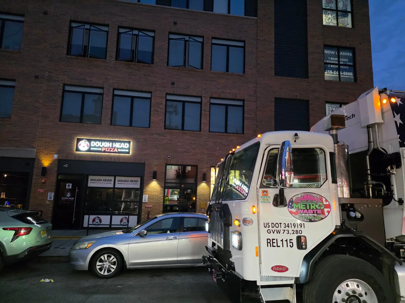 Front-load dumpster service at a Philadelphia retail location