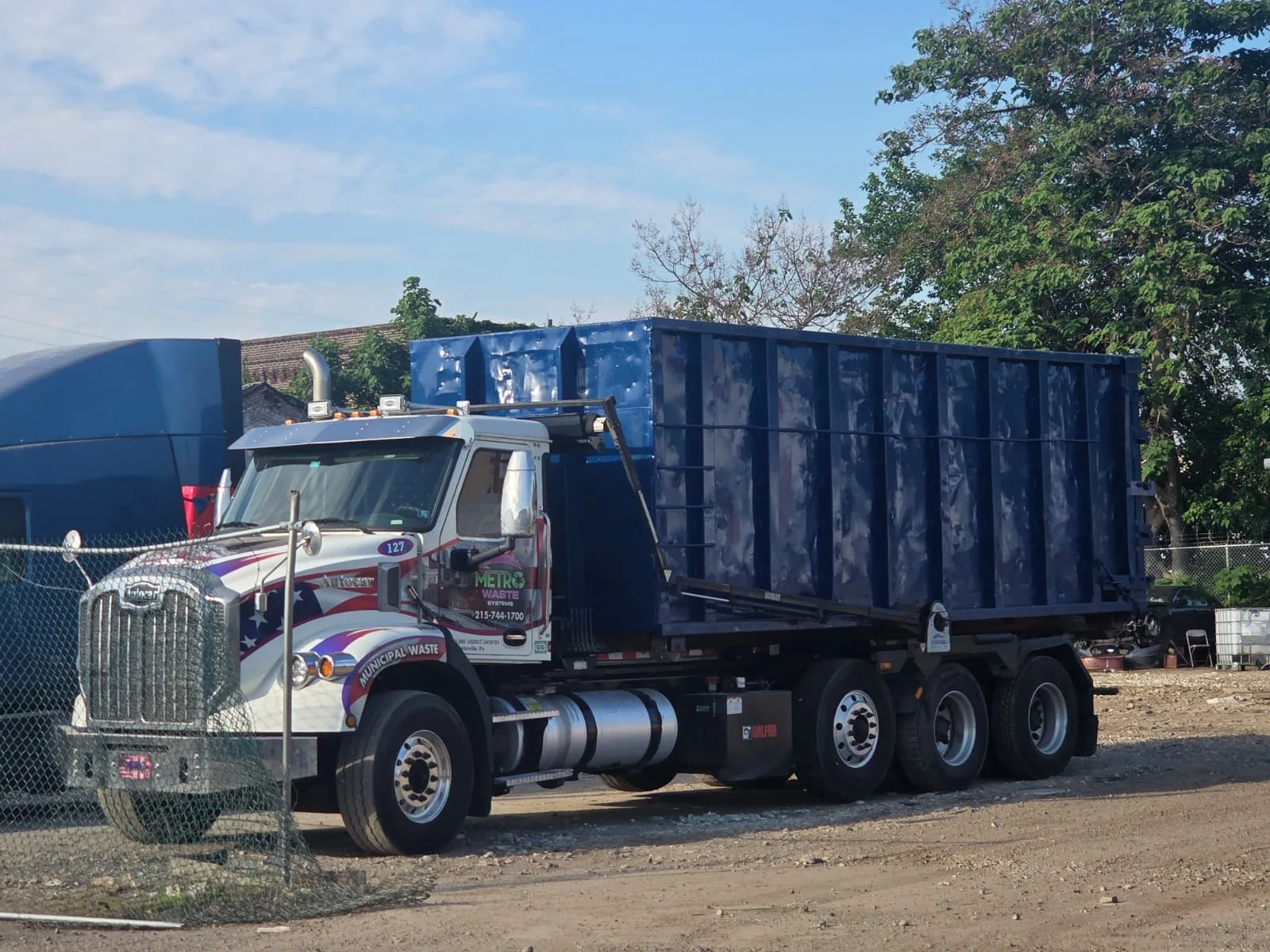 Metro Waste Solutions roll-off delivery in the Philadelphia metro area — real fleet photo 7